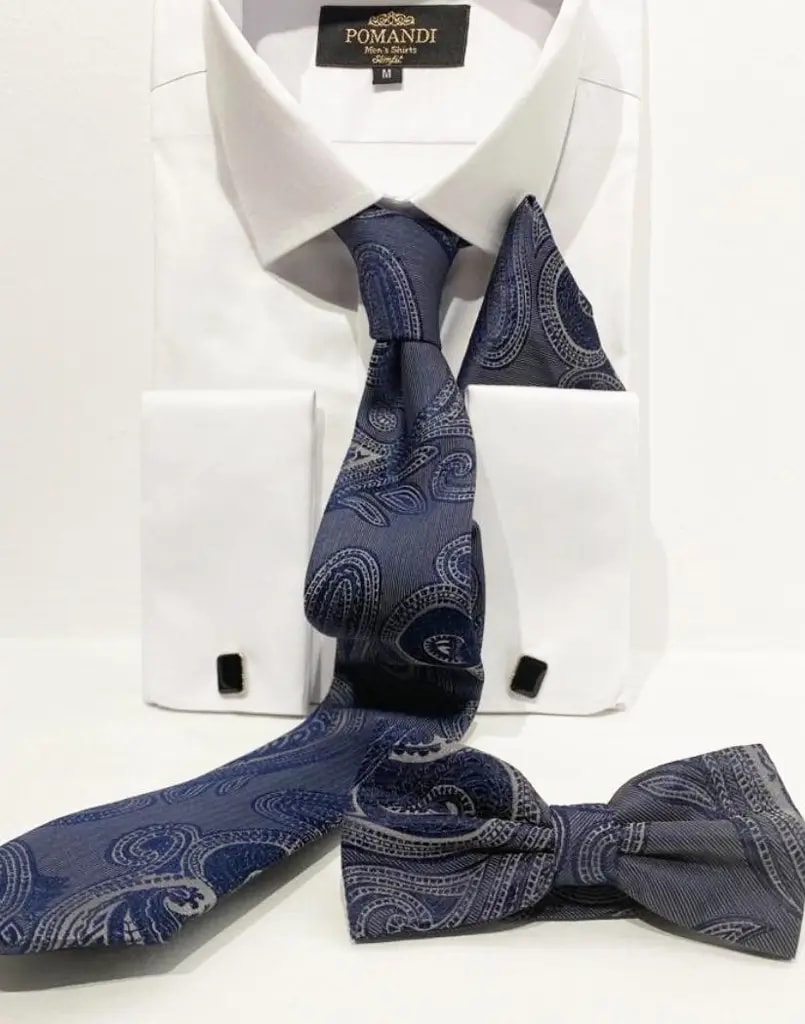 Chemise blanche avec cravate et nœud papillon bleu à motifs.